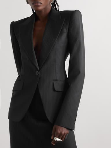 "Chic, structured blazer with a cinched waist"